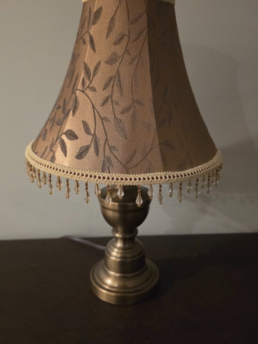 VTG Table Lamp features copper colored metal base with a fabric shade